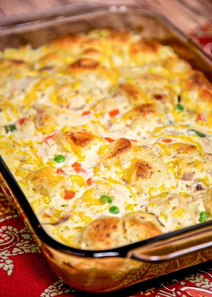 Chicken Pot Pie Bubble Up Recipe - chicken, chicken soup, sour cream, cheese, frozen vegetables and biscuits. A whole meal in one pan!