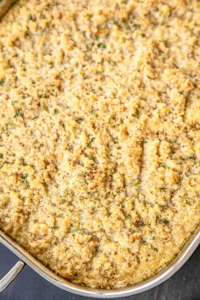 Cornbread Dressing - delicious southern holiday staple. Can make ahead and refrigerate or freezer for later. Makes enough to feed a crowd! Perfect for the holiday meal and leftovers. Homemade buttermilk cornbread, butter, onion, celery, sage, parsley, seasoned pepper, eggs, and chicken broth. A must for your holiday meal! #sidedish #holiday #thanksgiving #christmas #dressing #stuffing
