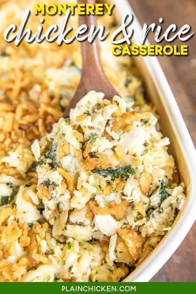 spooning chicken spinach and rice casserole from baking dish