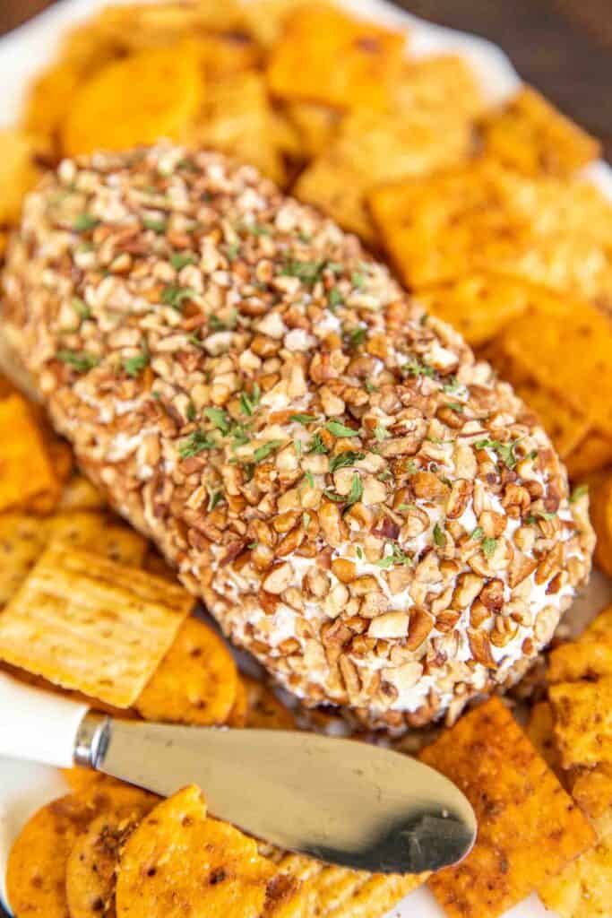 cheese ball rolled in pecans and crackers