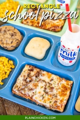 lunch tray with rectangle pizza, milk, corn, and a roll