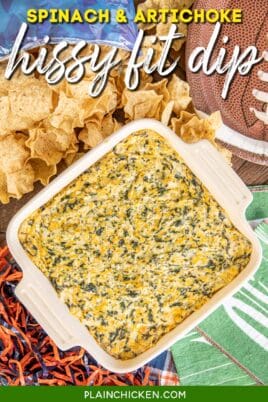 baking dish of spinach dip with chips on the table