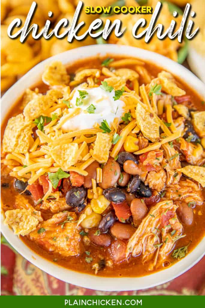 bowl of chili with beans topped with sour cream & fritos