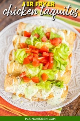 plate of chicken taquitos with lettuce and tomato
