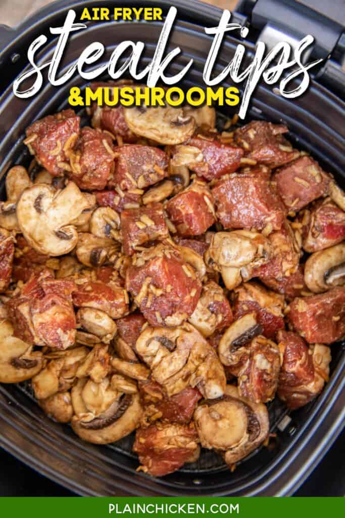 uncooked steak and mushrooms in air fryer basket