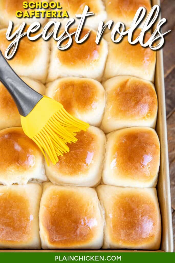 brushing yeast rolls with butter