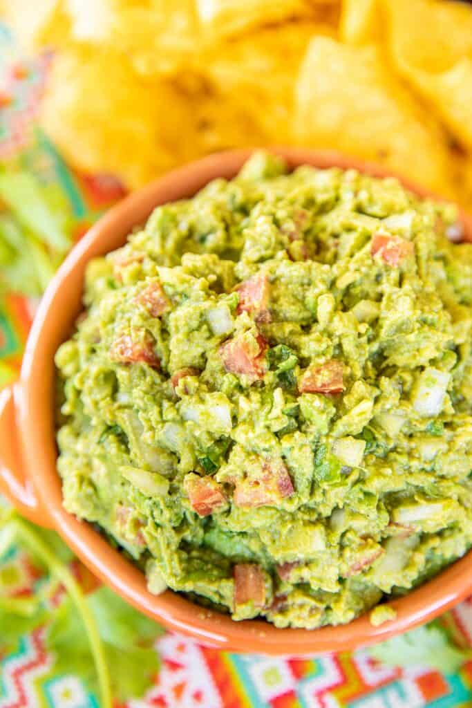 bowl of guacamole with chips