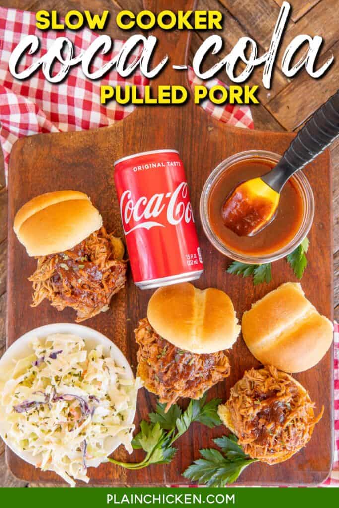 platter of pulled pork, bbq sauce, buns, slaw and can of coca-cola