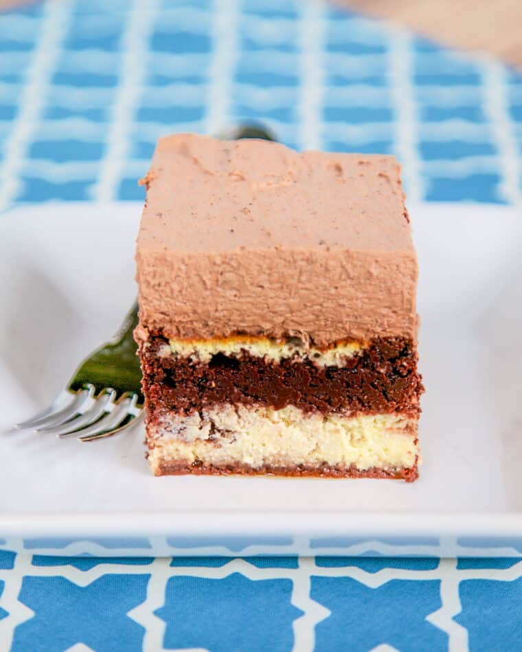 slice of tiramisu cheesecake layer cake