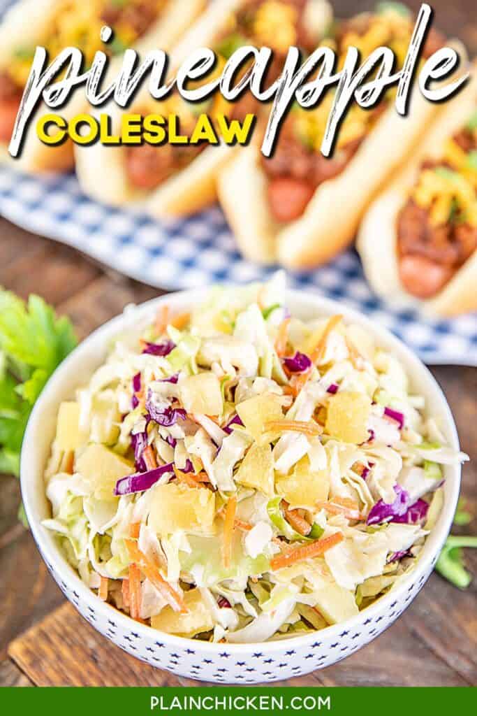 bowl of coleslaw with tray of hot dogs