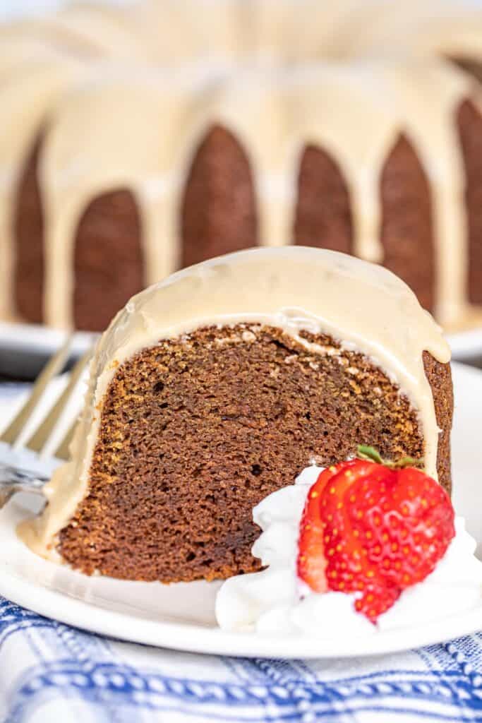 slice of chocolate cake with glaze and strawberries