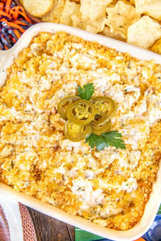 baking dish of dip topped with jalapenos
