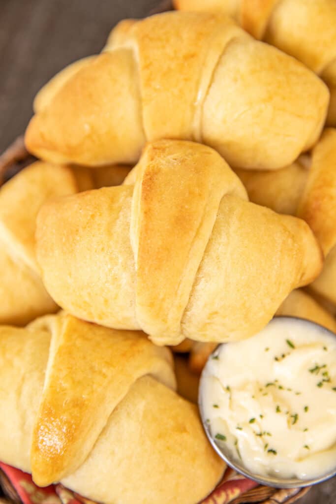 crescent roll in a basket with butter