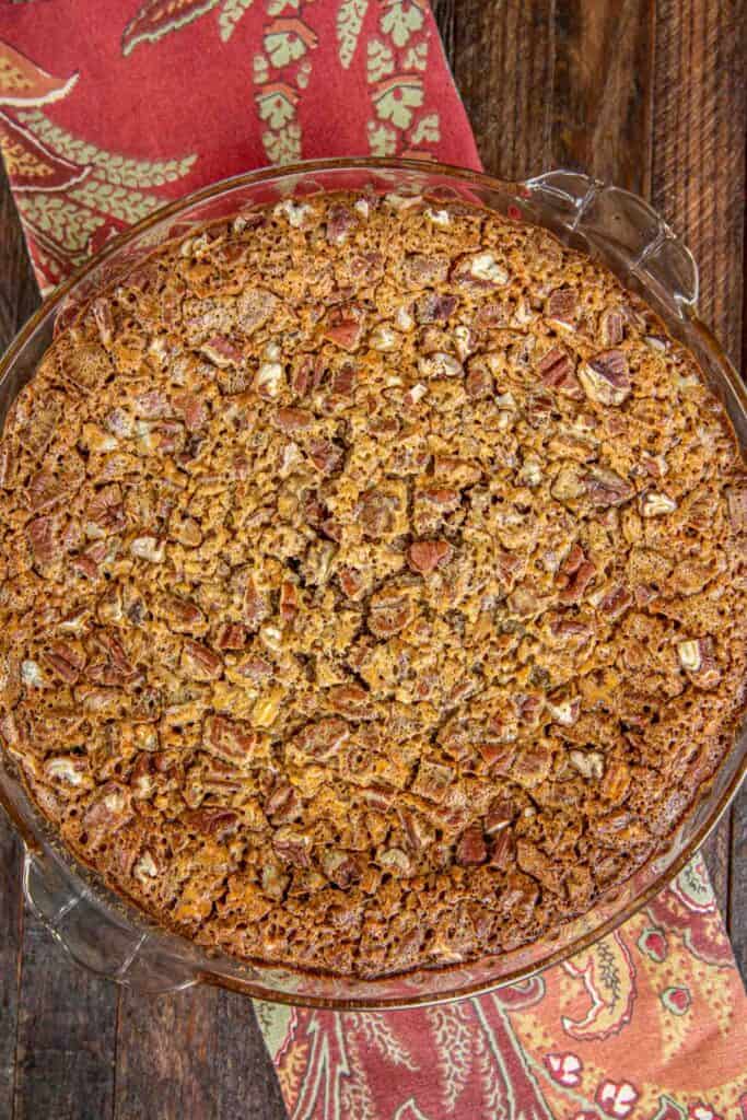whole pecan pie in a pie dish
