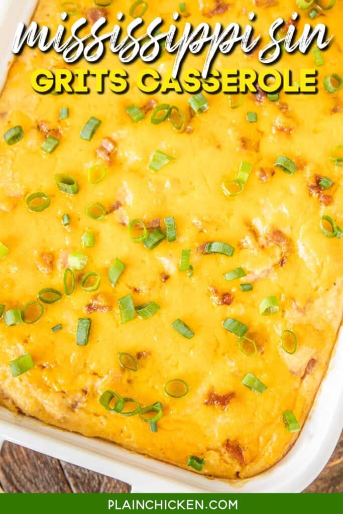 ham and cheese grits casserole topped with green onions in a baking dish