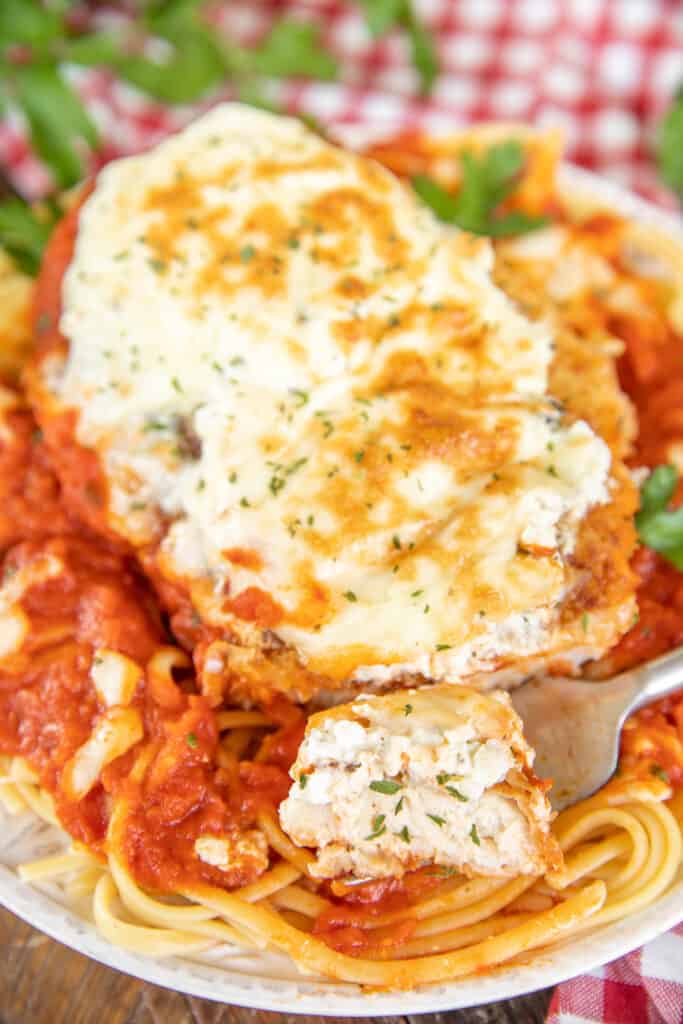 chicken parmesan with pasta on a plate
