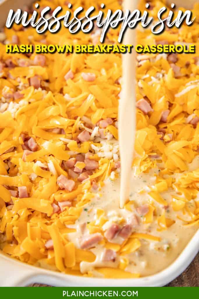 pouring egg custard over ham cheese and hash browns