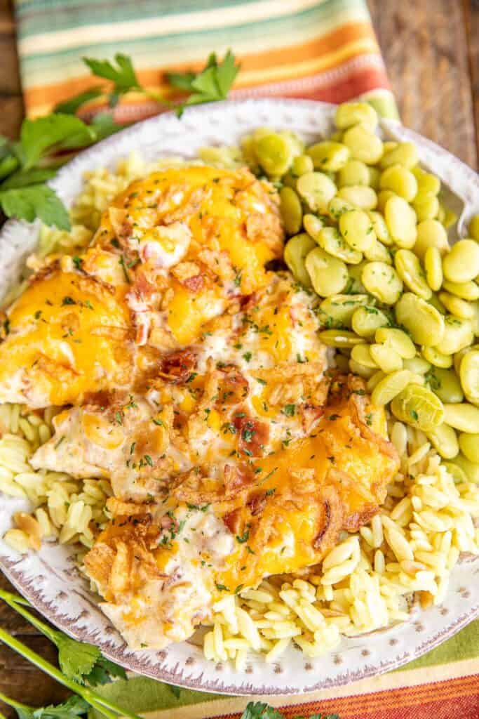 cheddar bacon smothered chicken on a plate