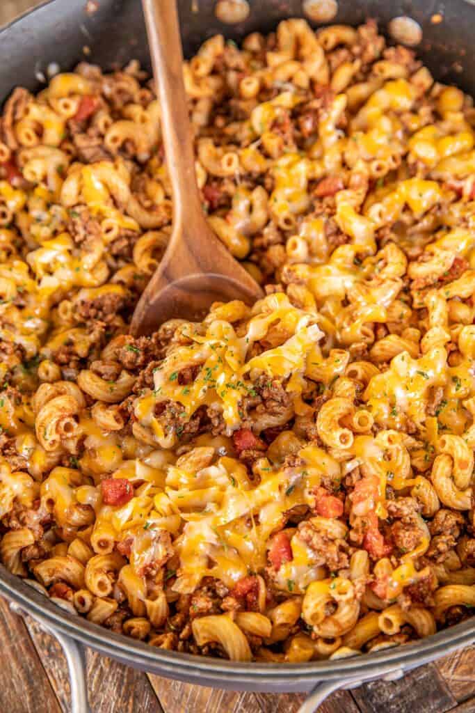 skillet of cheese topped macaroni and beef skillet