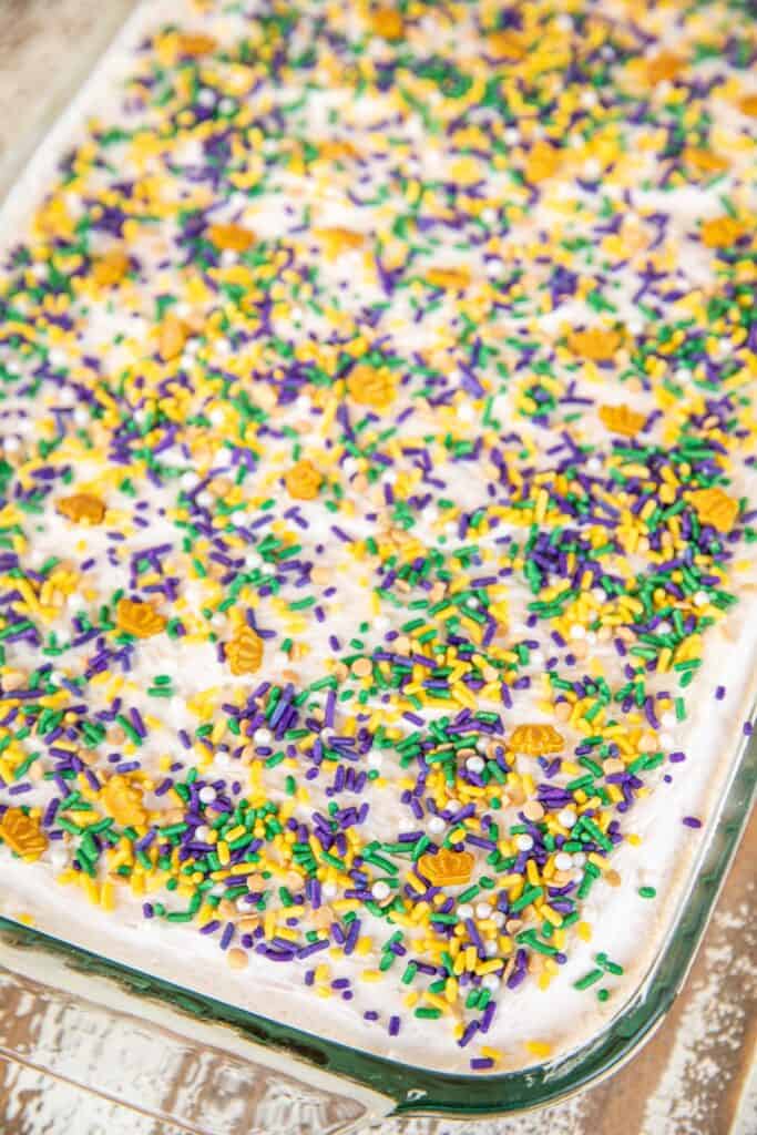 poke cake topped with sprinkles