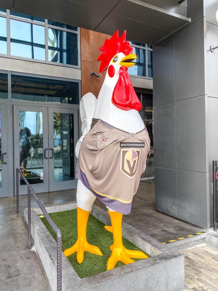 chicken statue with hockey jersey on