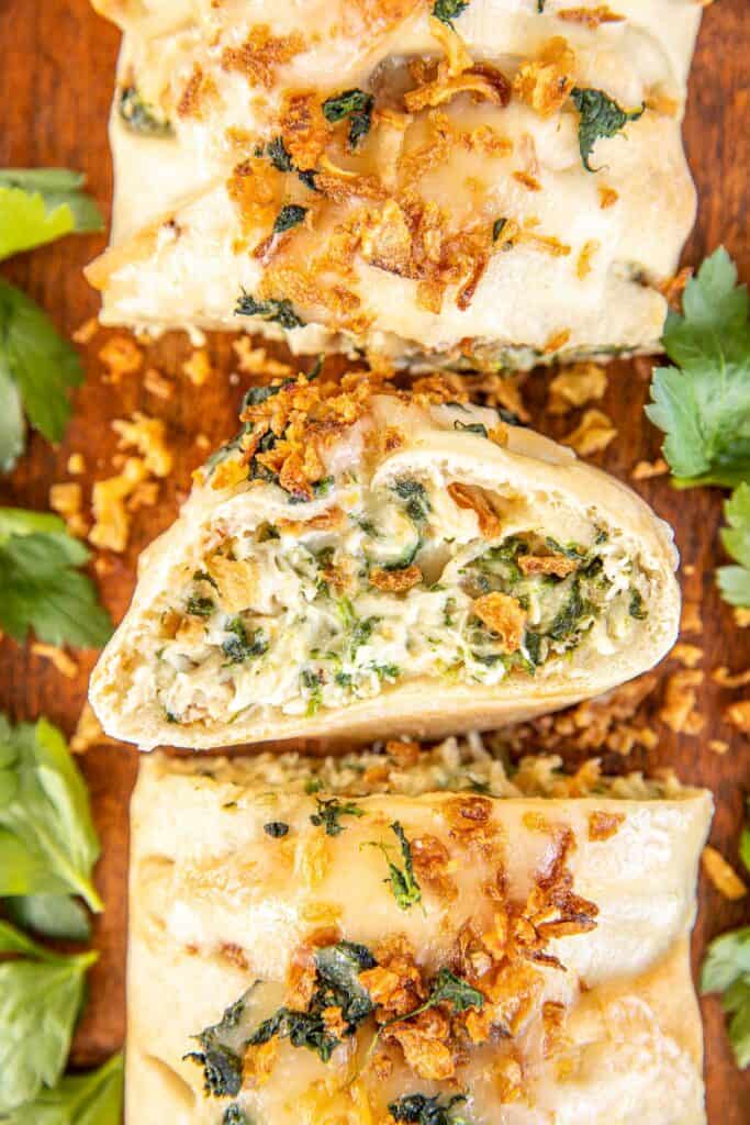 cross section of cheesy chicken and spinach braid