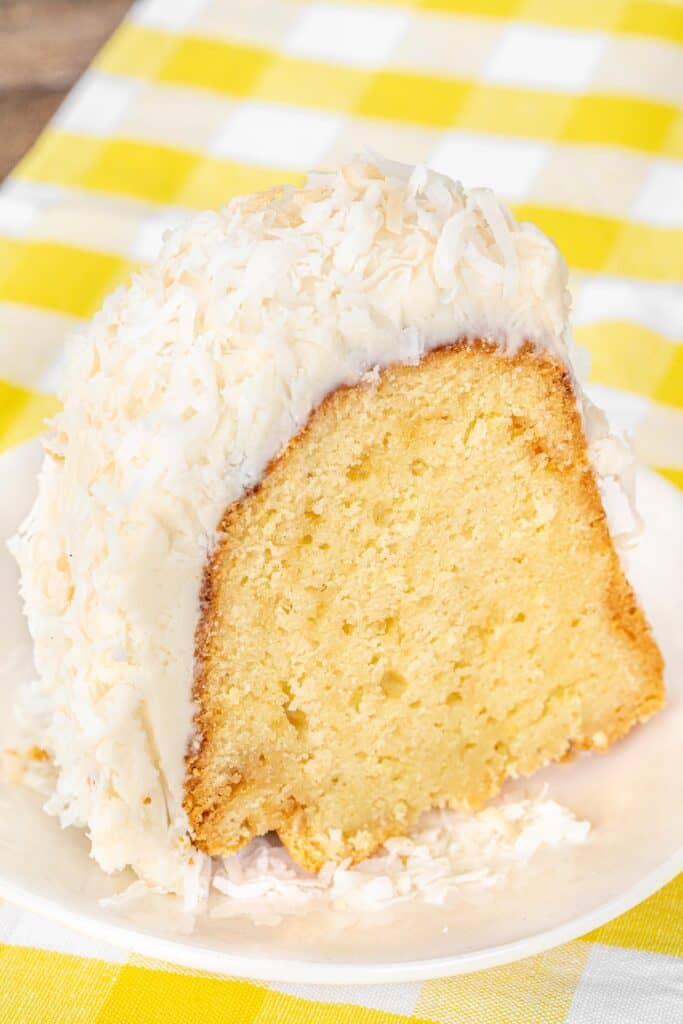 slice of white chocolate coconut cake on a plate