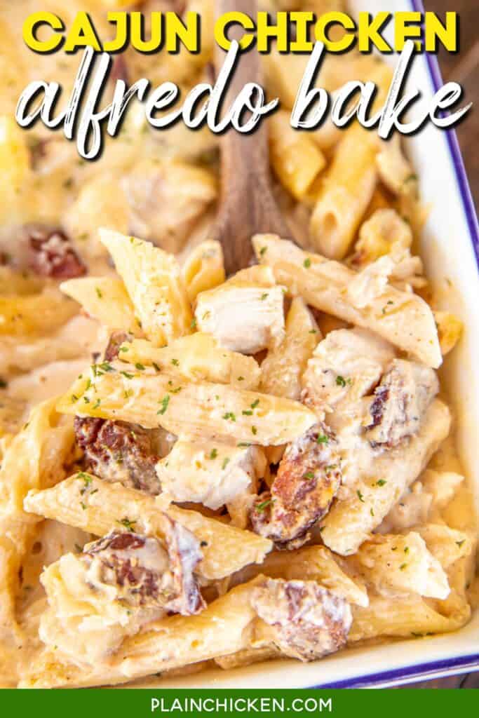 spooning cajun chicken pasta from baking dish with text overaly