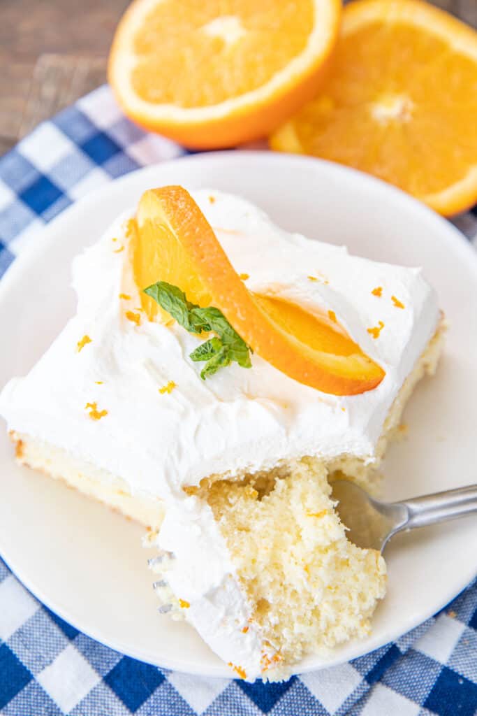 slice cake topped with an orange slice