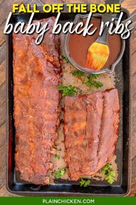 baby back ribs on a baking sheet with bbq sauce and text overlay