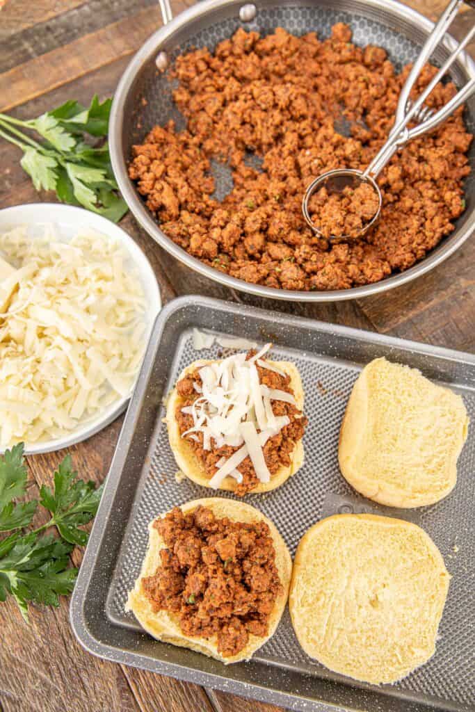 assembling sloppy joes on a table