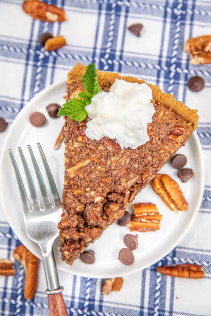 slice of chocolate pecan pie on a plate