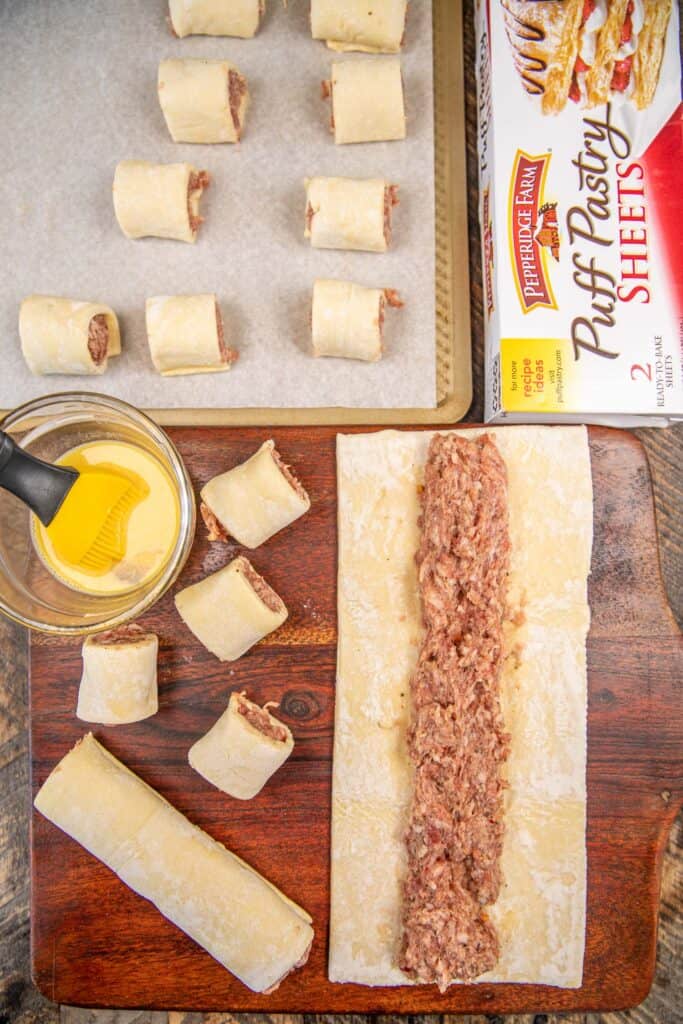assembling sausage rolls with puff pastry