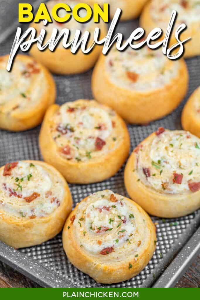 bacon pinwheels on a baking sheet with text overlay
