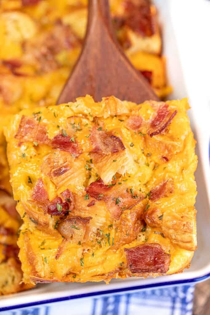 slice of bacon and cheese breakfast casserole on a spatula