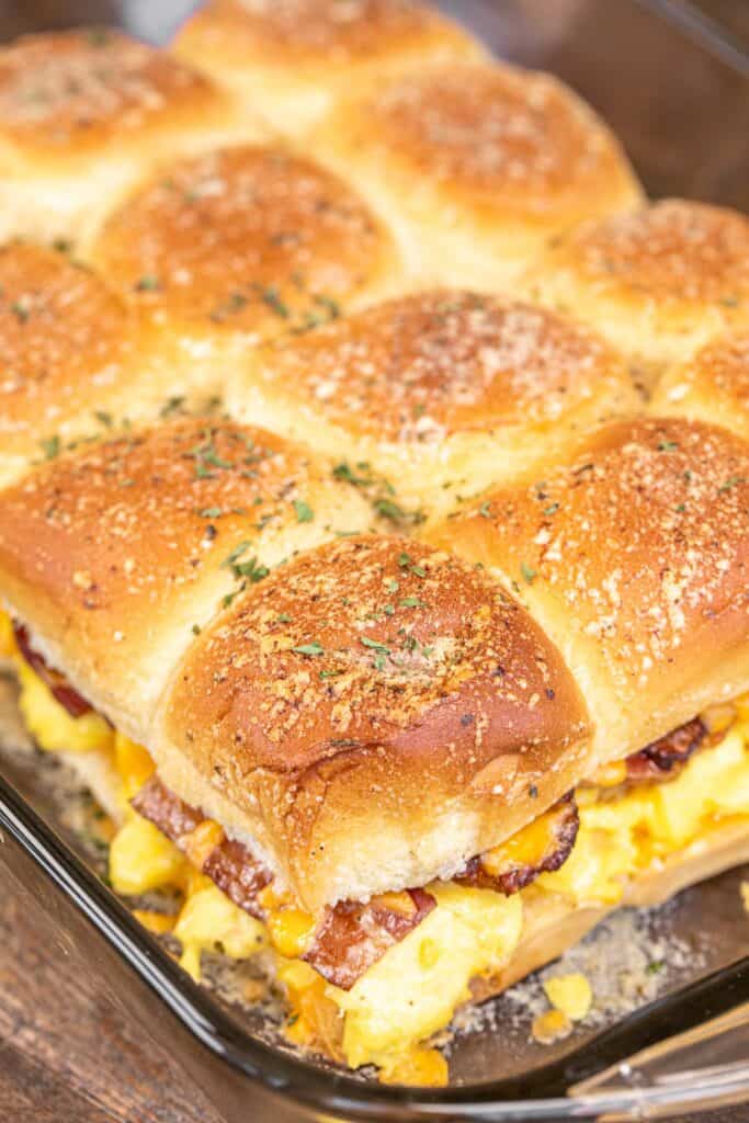 bacon egg and cheese sliders in a baking dish