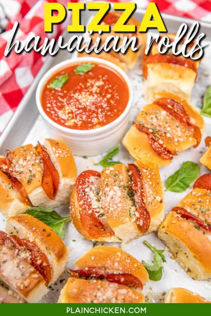 pizza hawaiian rolls on a baking sheet with pizza sauce with text overlay