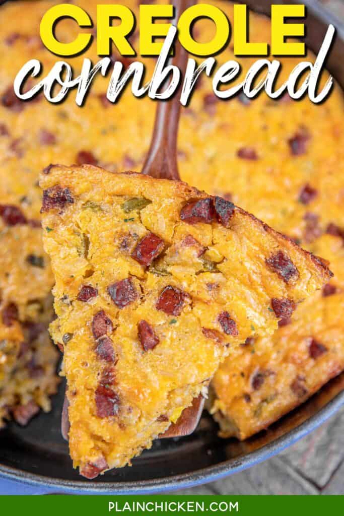 slice of cornbread loaded with smoked sausage on a spatula with text overlay