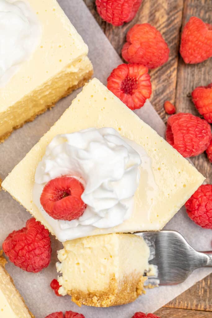 cutting a slice of cheesecake with a fork