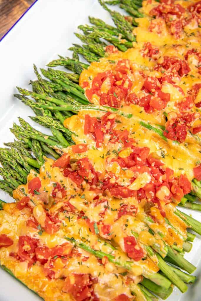cheese and rotel topped green beans in a baking dish