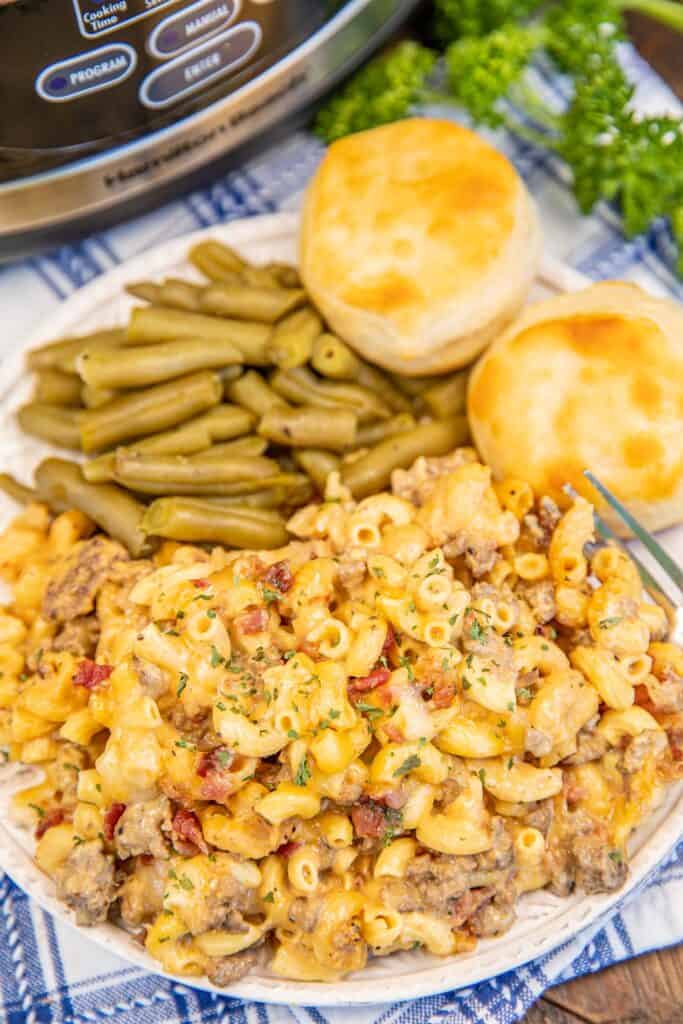 plate of macaroni and cheese with green beans and biscuits