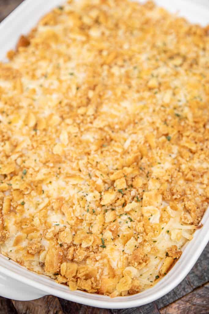 baking dish of potato casserole with crushed ritz crackers on top