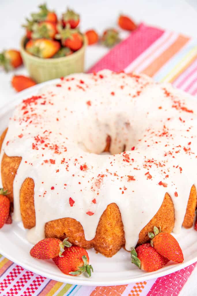 strawberry bundt cake topped with vanilla glaze