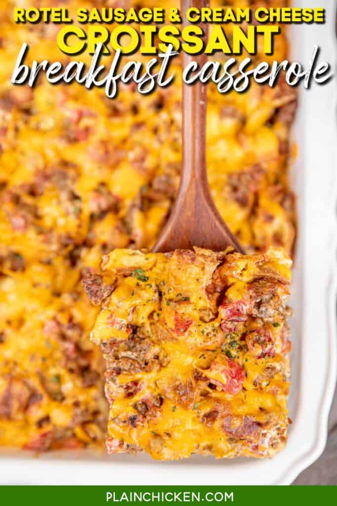 serving a slice of croissant breakfast casserole from a baking dish with text overlay