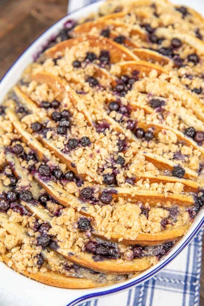 blueberry pancake casserole topped with streusel in a baking dish