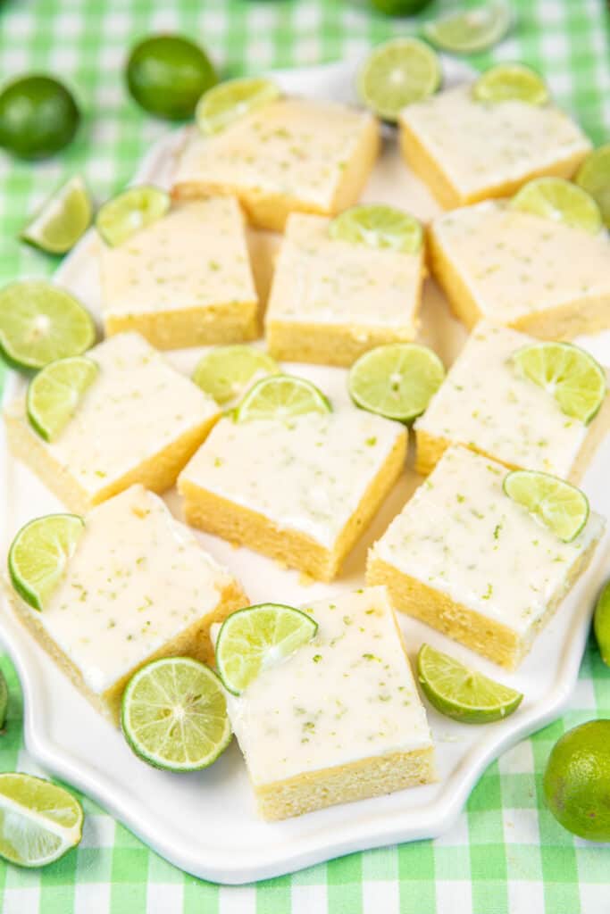 plate of key lime brownies with limes