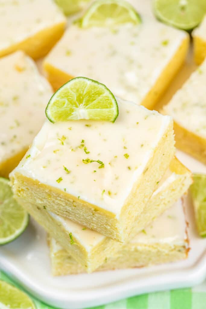stack of key lime brownies on a platter