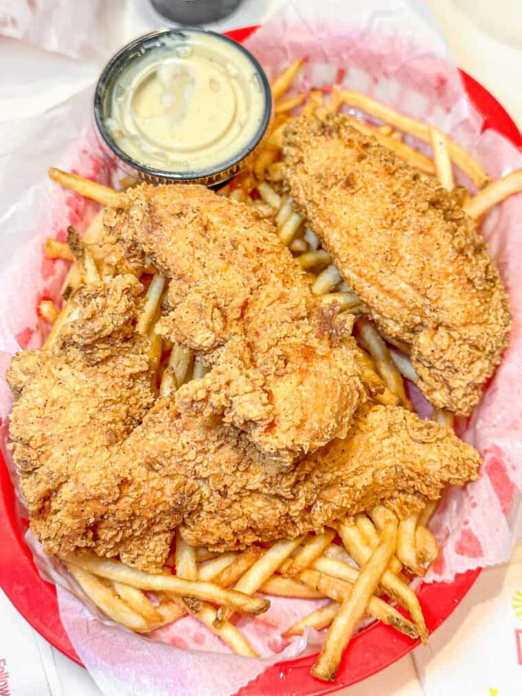 fried chicken finger basket with fries and honey mustard