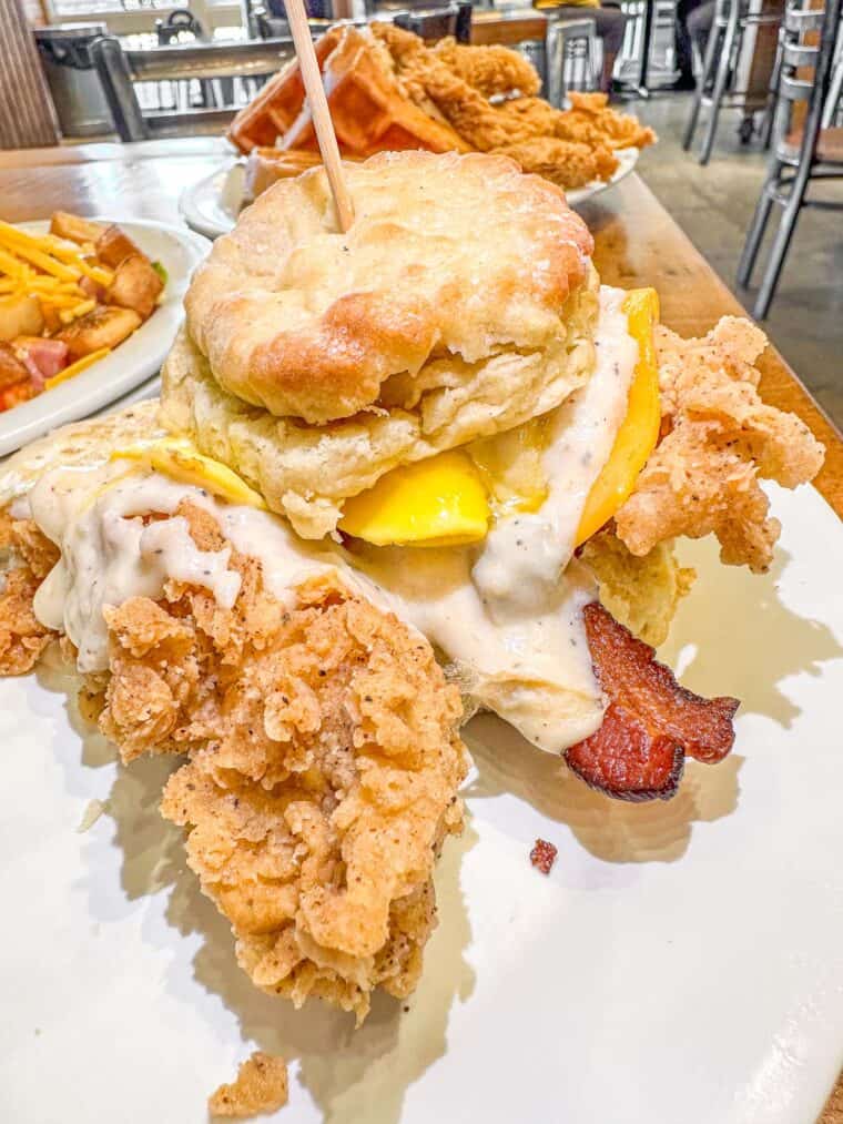 chicken biscuit with gravy on a plate
