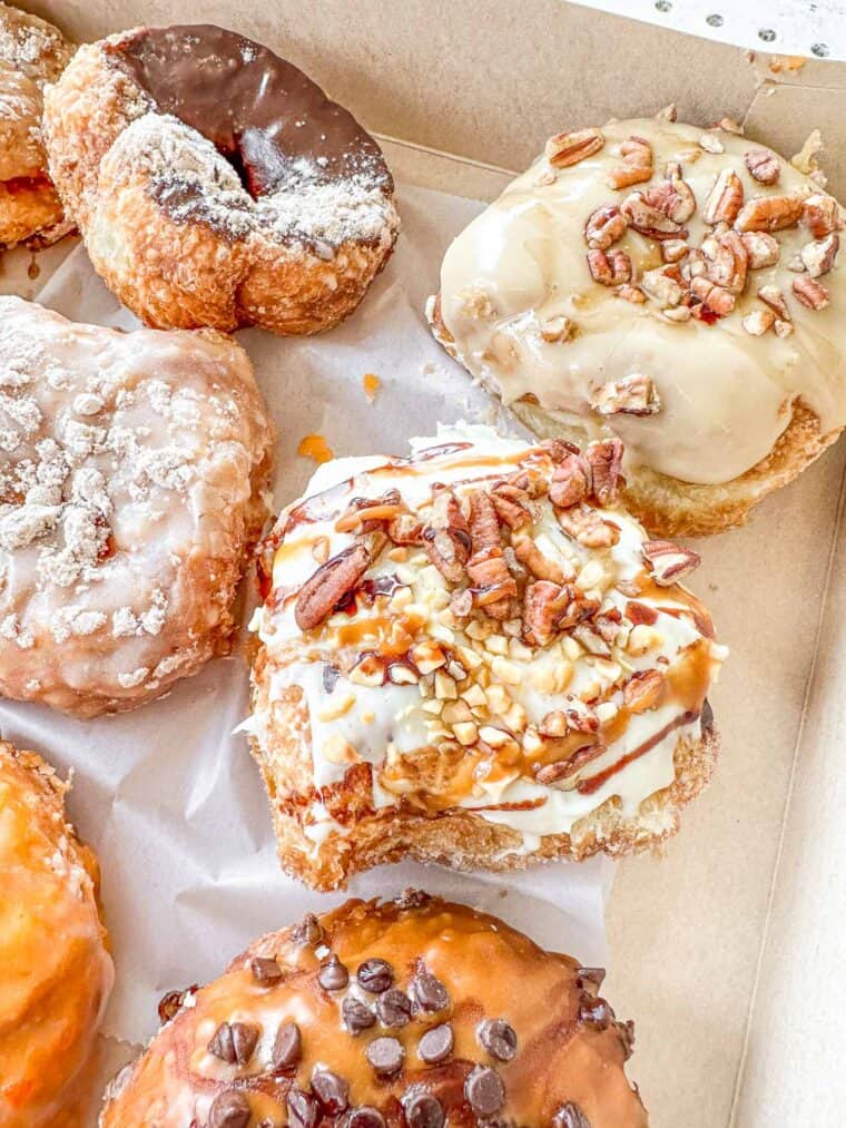 close up of doughnuts in a box